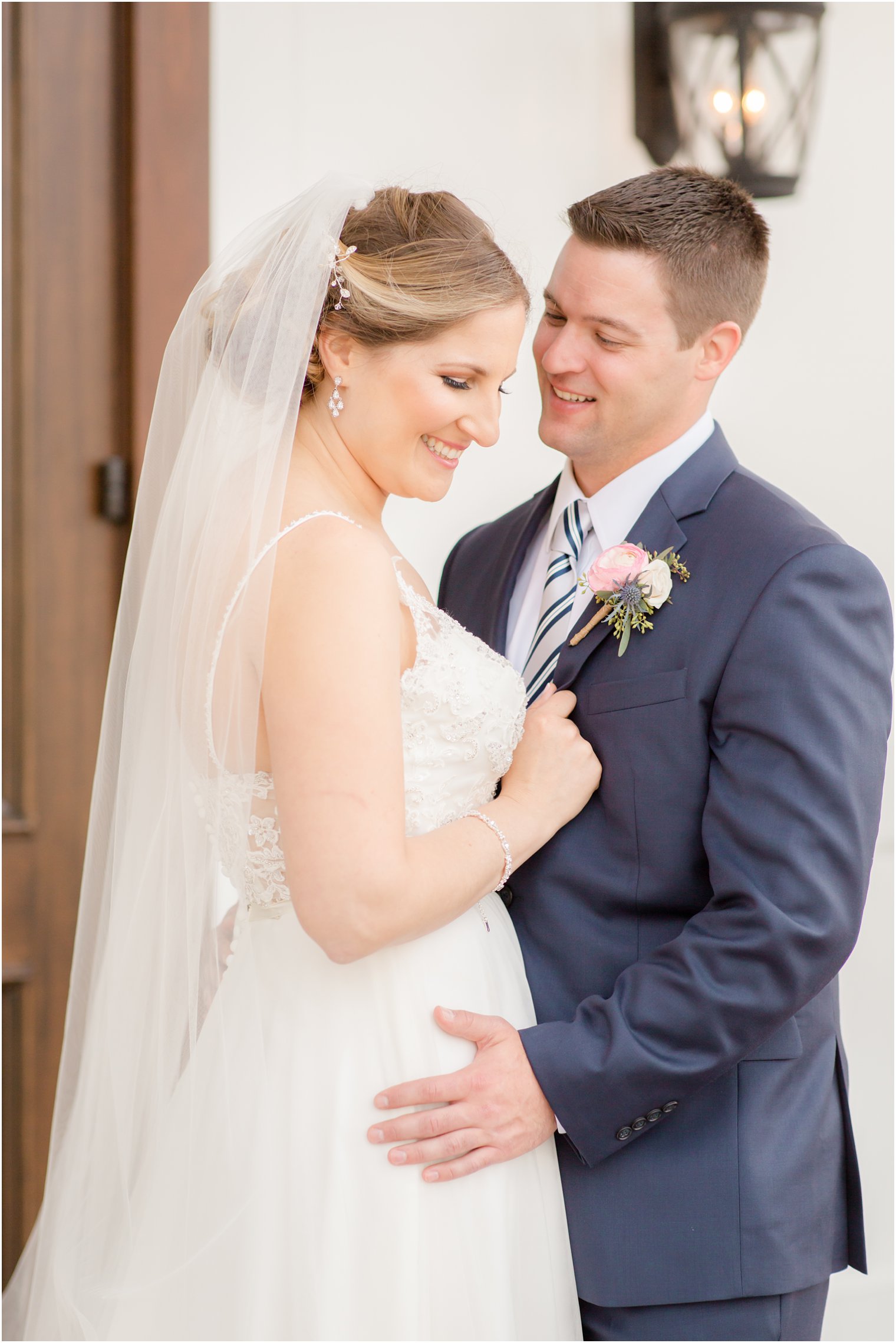 Bride and groom in front of The Mill Lakeside Manor