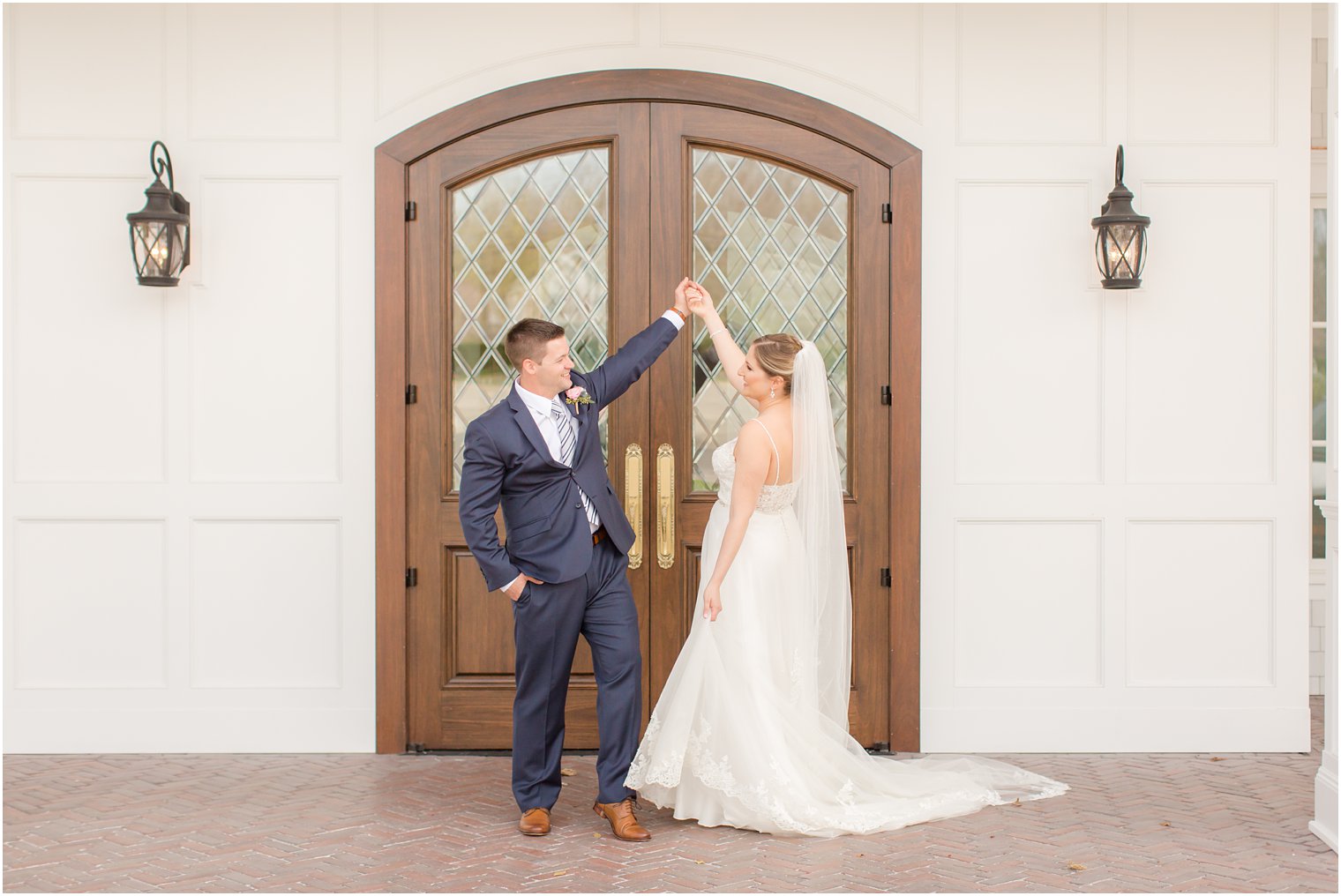 Groom twirling his bride at The Mill Lakeside Manor Wedding