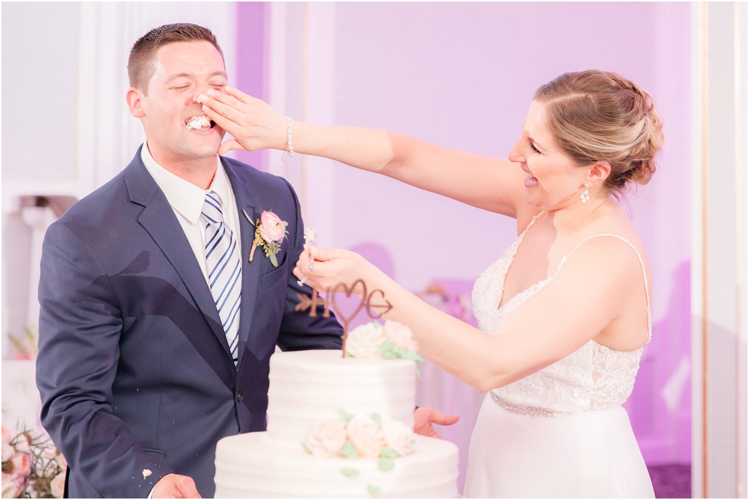 Bride and groom cutting cake during wedding reception at The Mill at Lakeside Manor in Spring Lake NJ