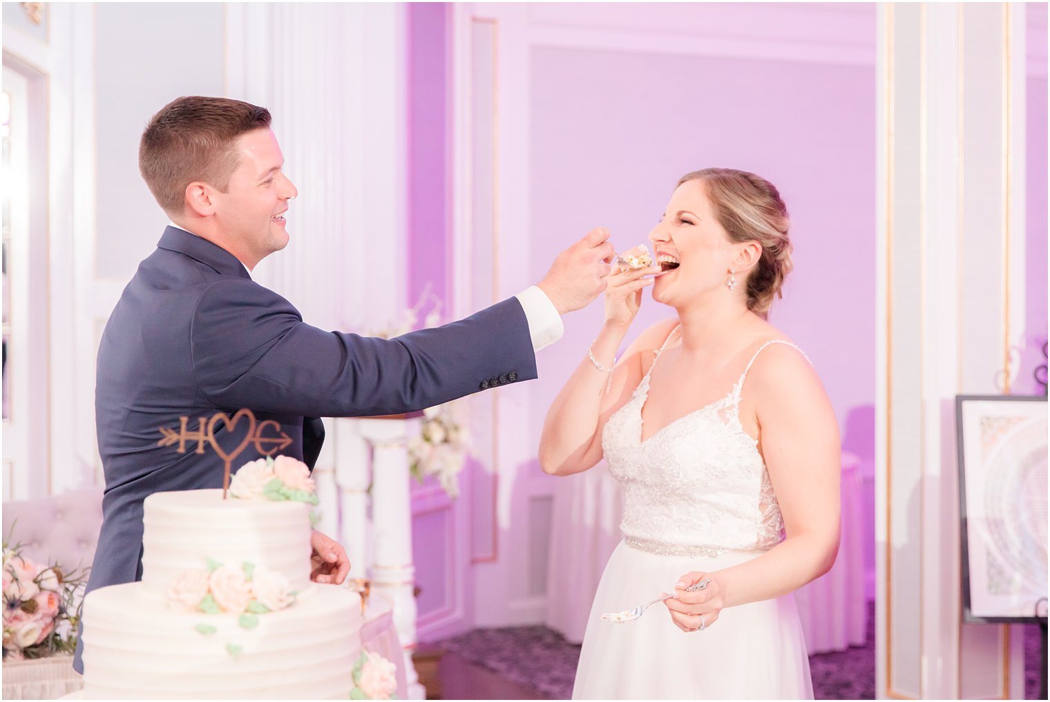 Bride and groom cutting cake during wedding reception at The Mill at Lakeside Manor in Spring Lake NJ