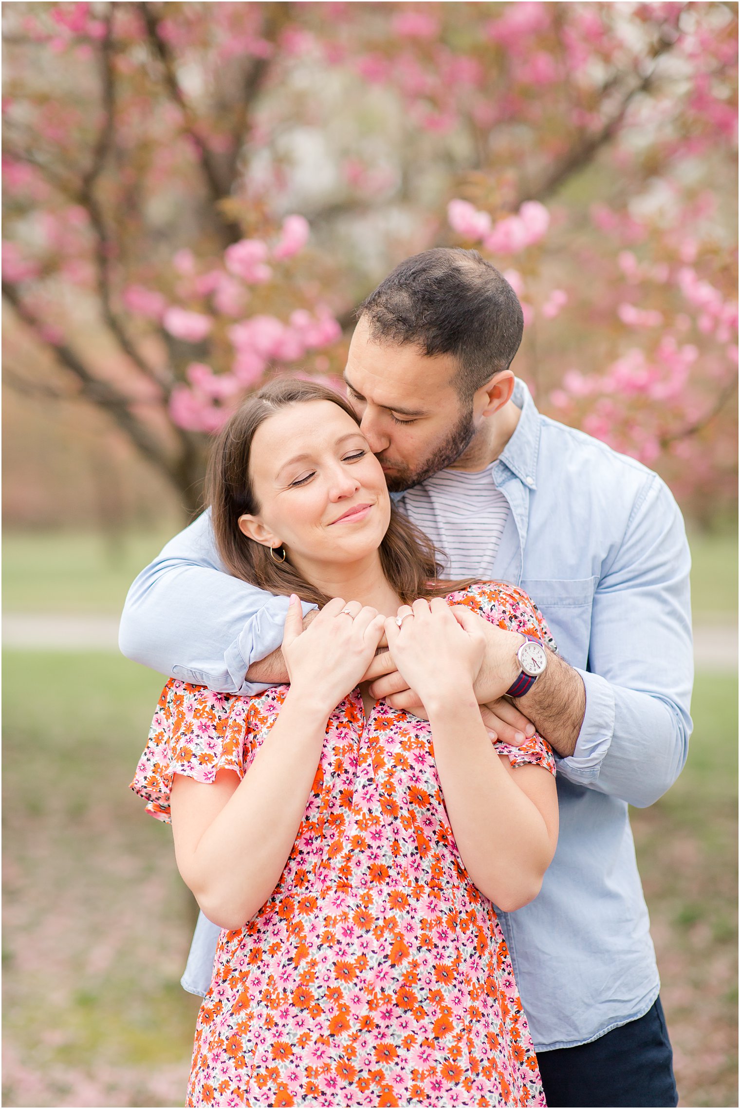 Engaged couple at Branch Brook Park in Newark NJ during cherry blossoms