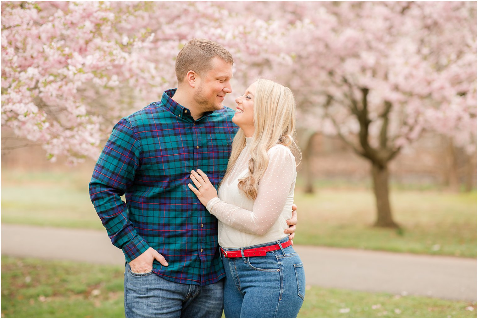 Spring Cherry Blossom Engagement session photos with dog at Branch Brook Park by Idalia Photography