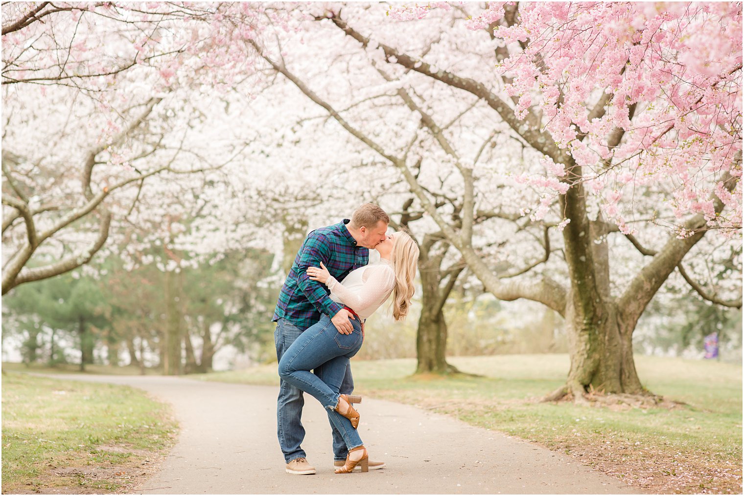 Spring Cherry Blossom Engagement session photos with dog at Branch Brook Park by Idalia Photography