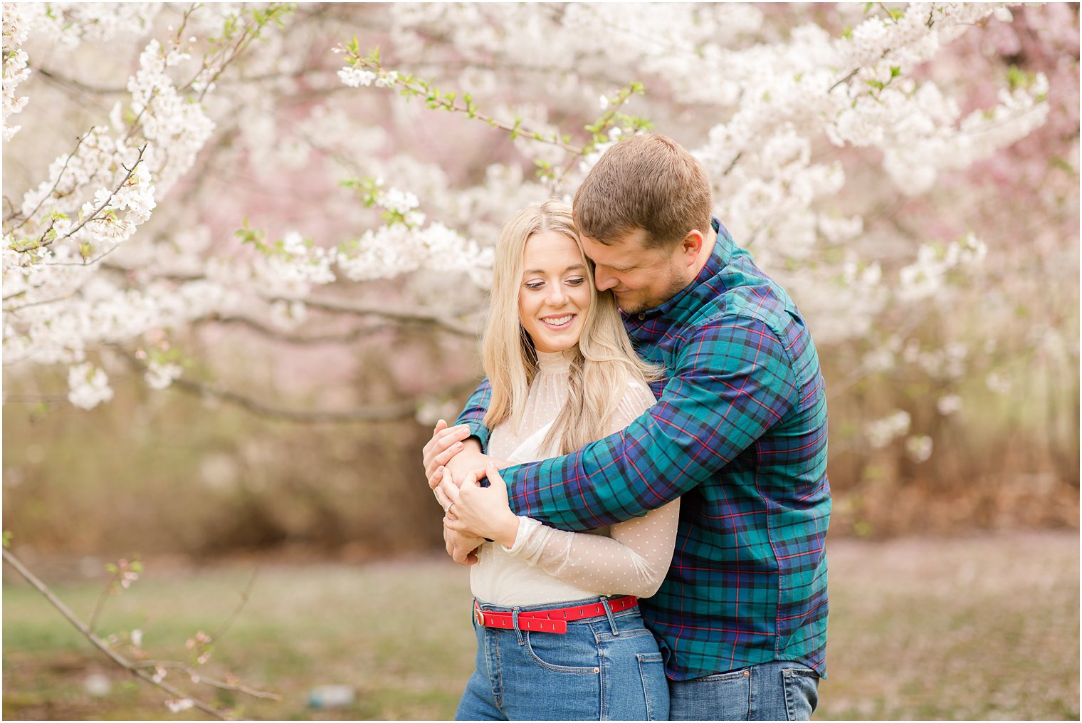 Spring Cherry Blossom Engagement session photos with dog at Branch Brook Park by Idalia Photography