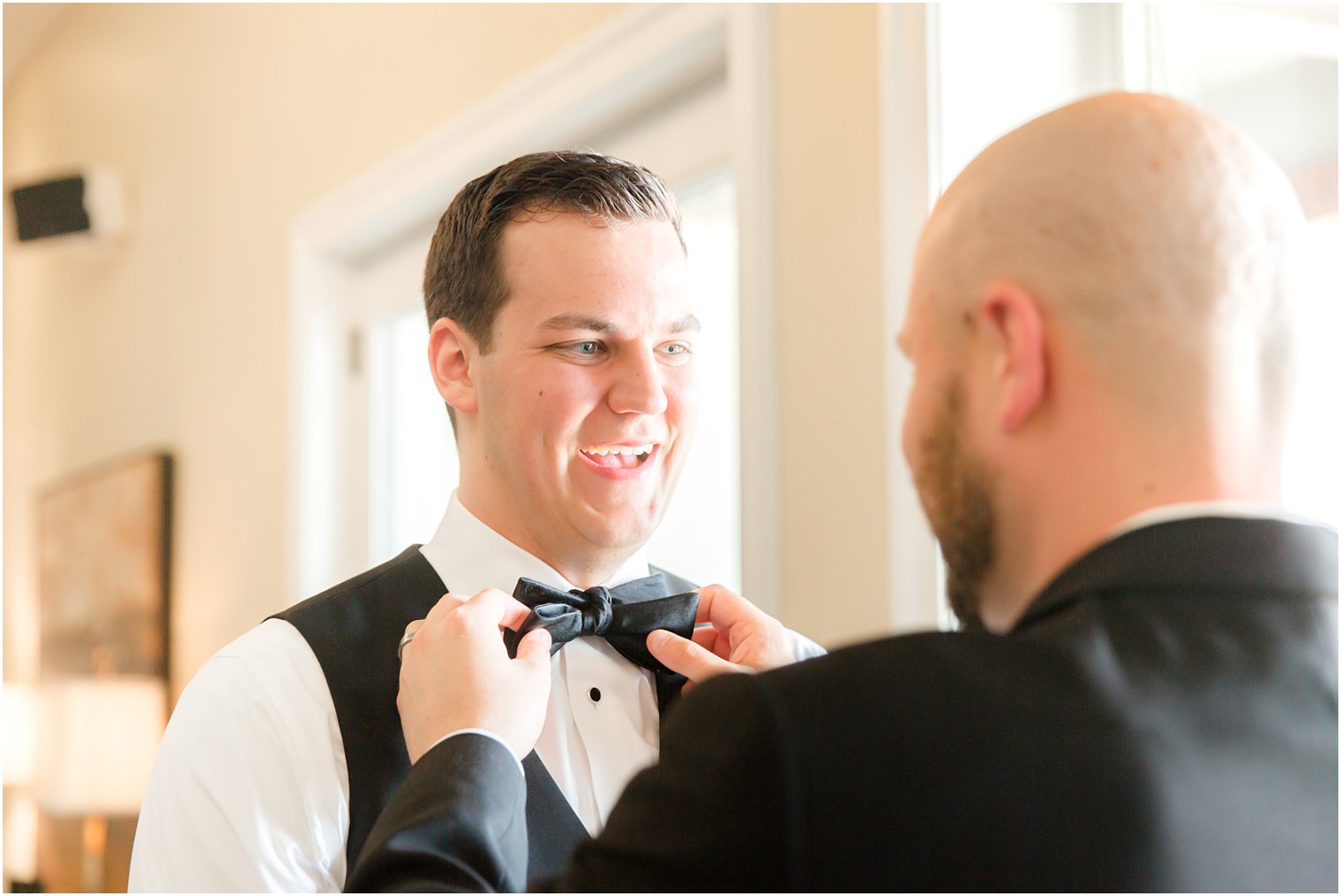 groom getting ready with best man in Stone Tower Winery Wedding Photos by Idalia Photography