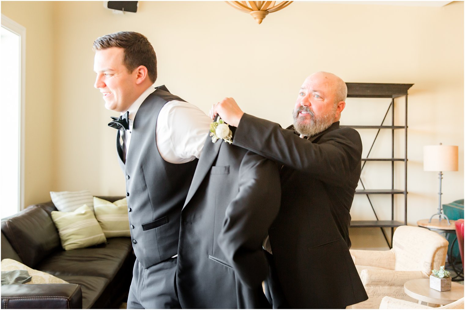 groom getting ready with father in Stone Tower Winery Wedding Photos by Idalia Photography