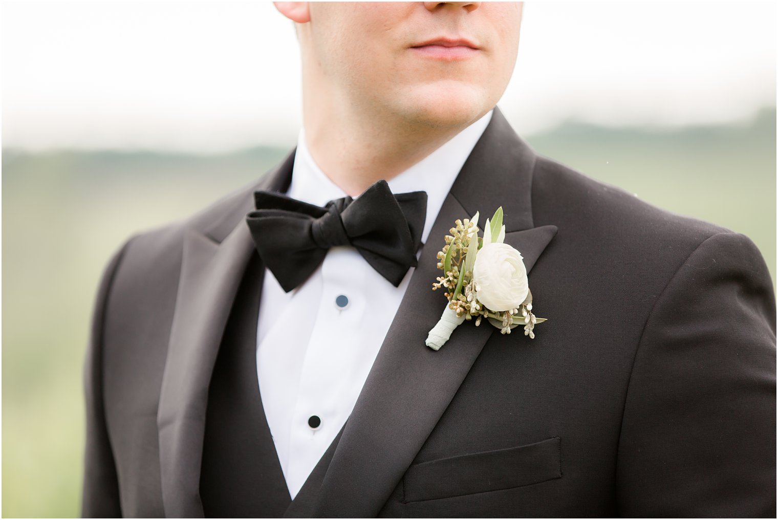 boutonniere by Holly Chapple in Stone Tower Winery Wedding Photos by Idalia Photography