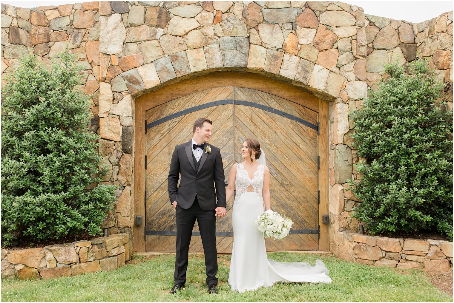 bride and groom holding hands in Stone Tower Winery Wedding Photos by Idalia Photography