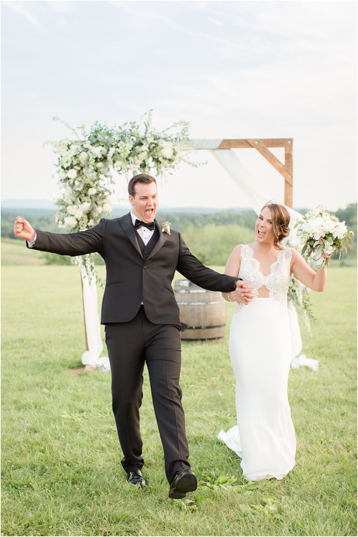 couple under arbor in Stone Tower Winery Wedding Photos by Idalia Photography