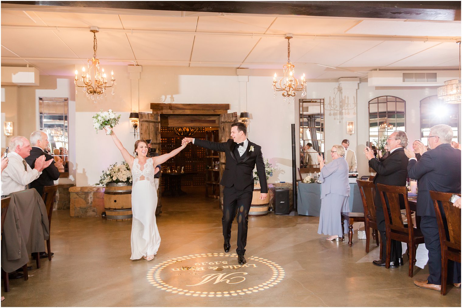 wedding reception entrance in Stone Tower Winery Wedding Photos by Idalia Photography