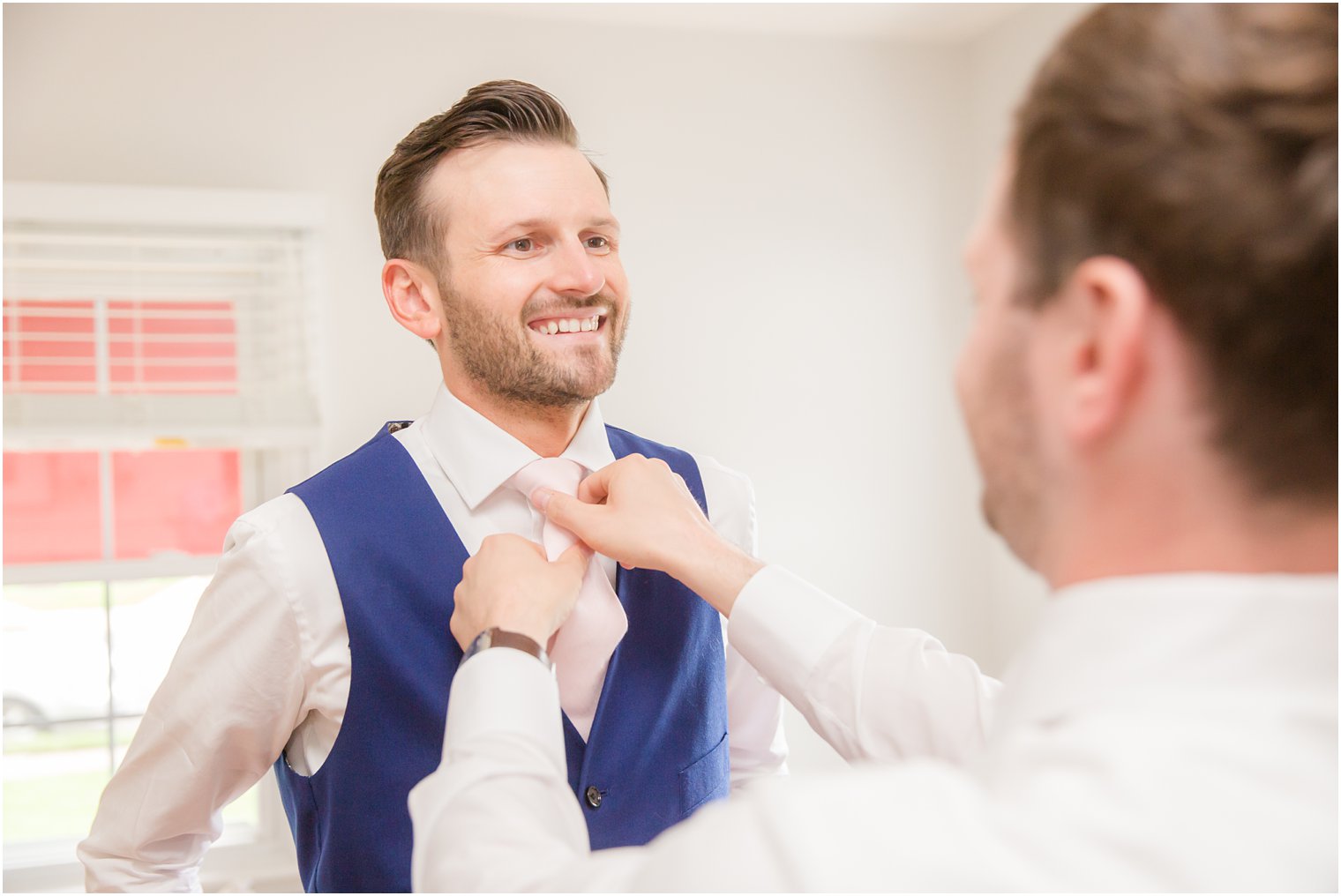 groom getting ready with best man