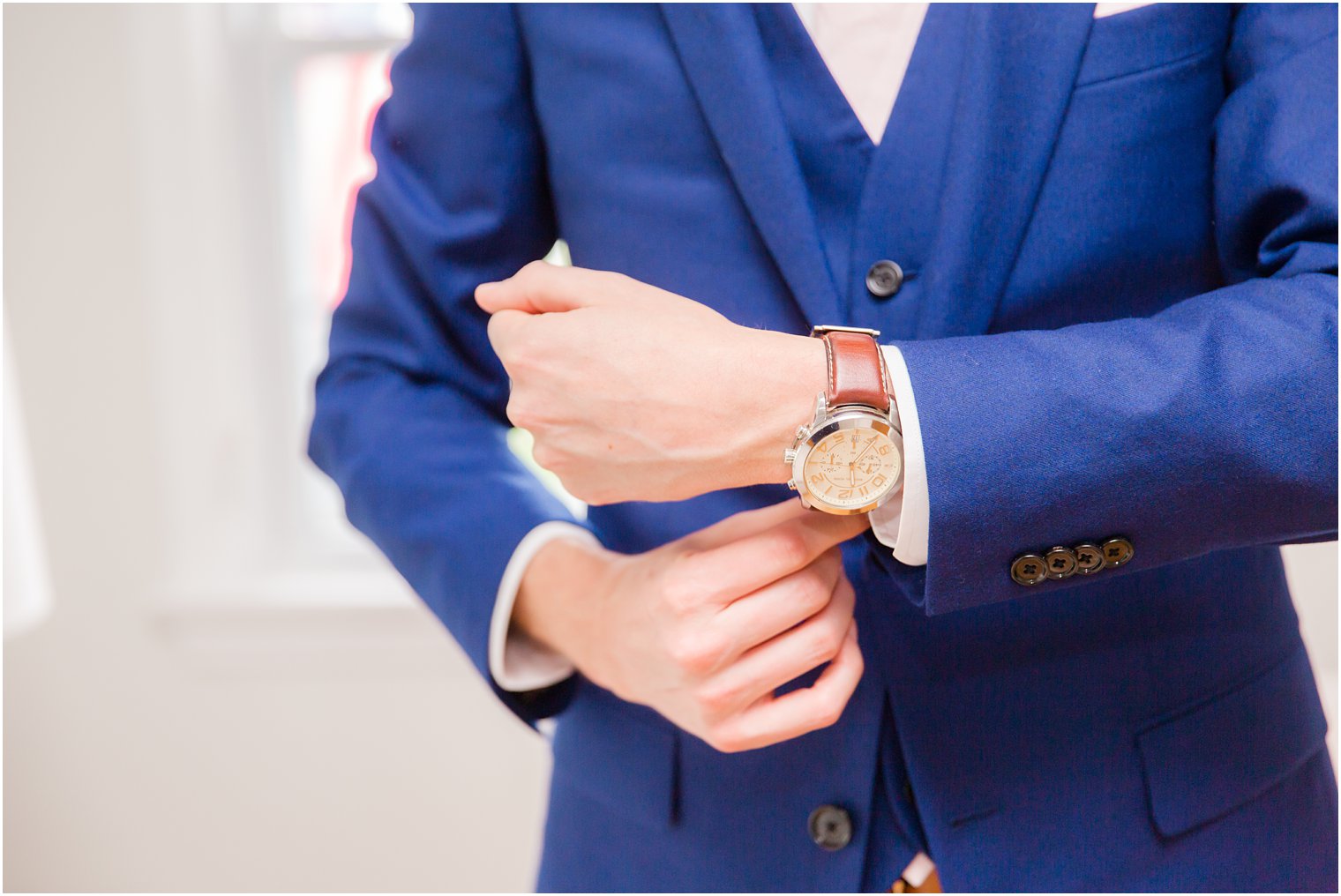 groom putting on his watch