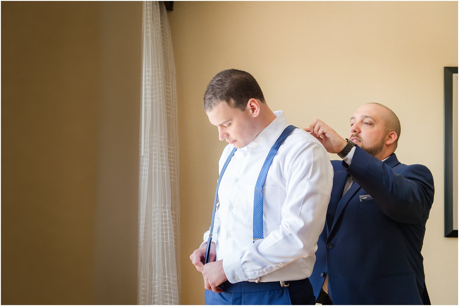 Groom getting ready with best man for wedding at Windows on the Water at Frogbridge in Millstone NJ