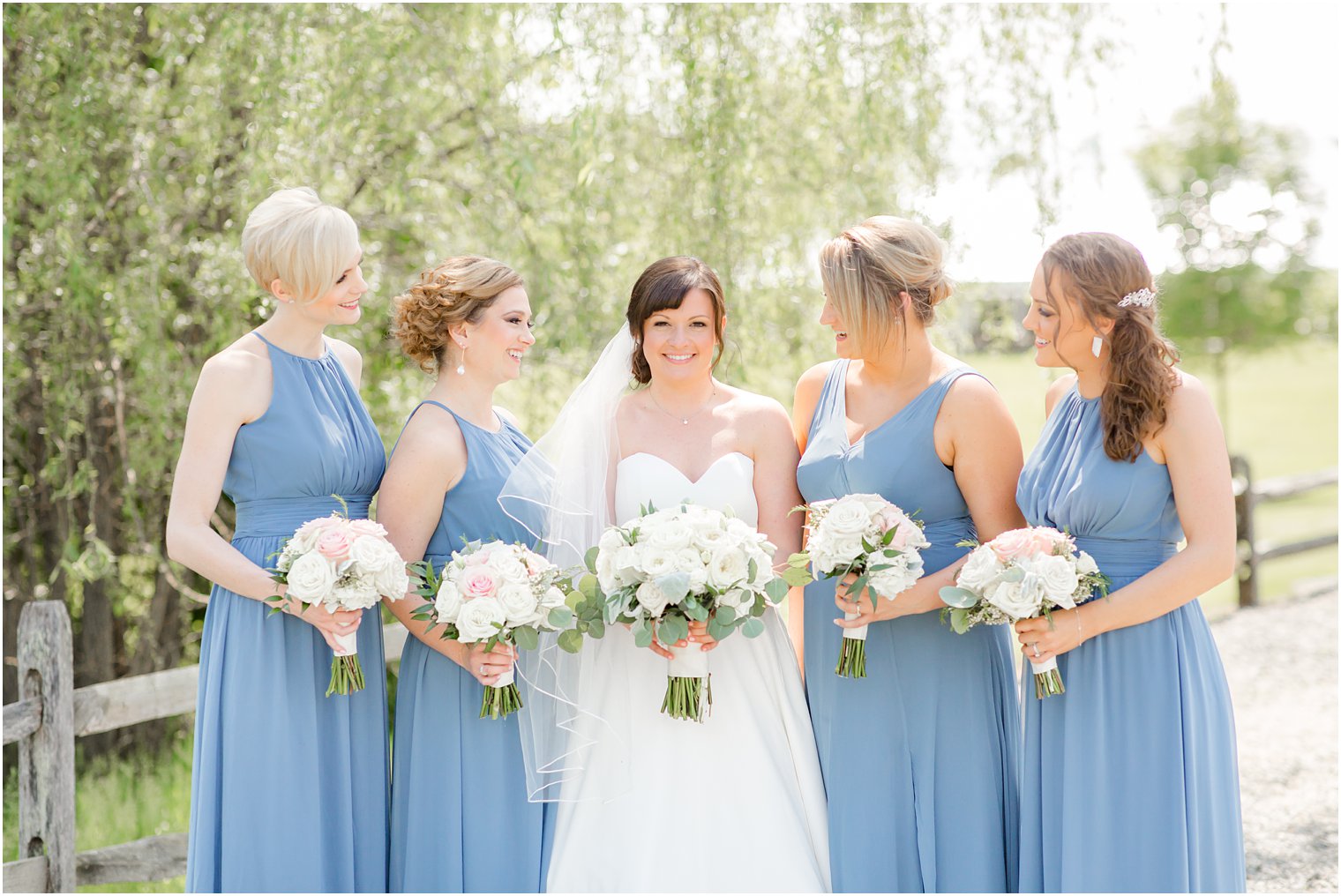Bridesmaids with bride and beautiful florals 