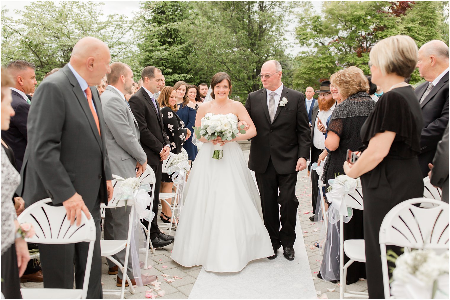 Bride walking down the aisle at Windows on the Water at Frogbridge in Millstone NJ