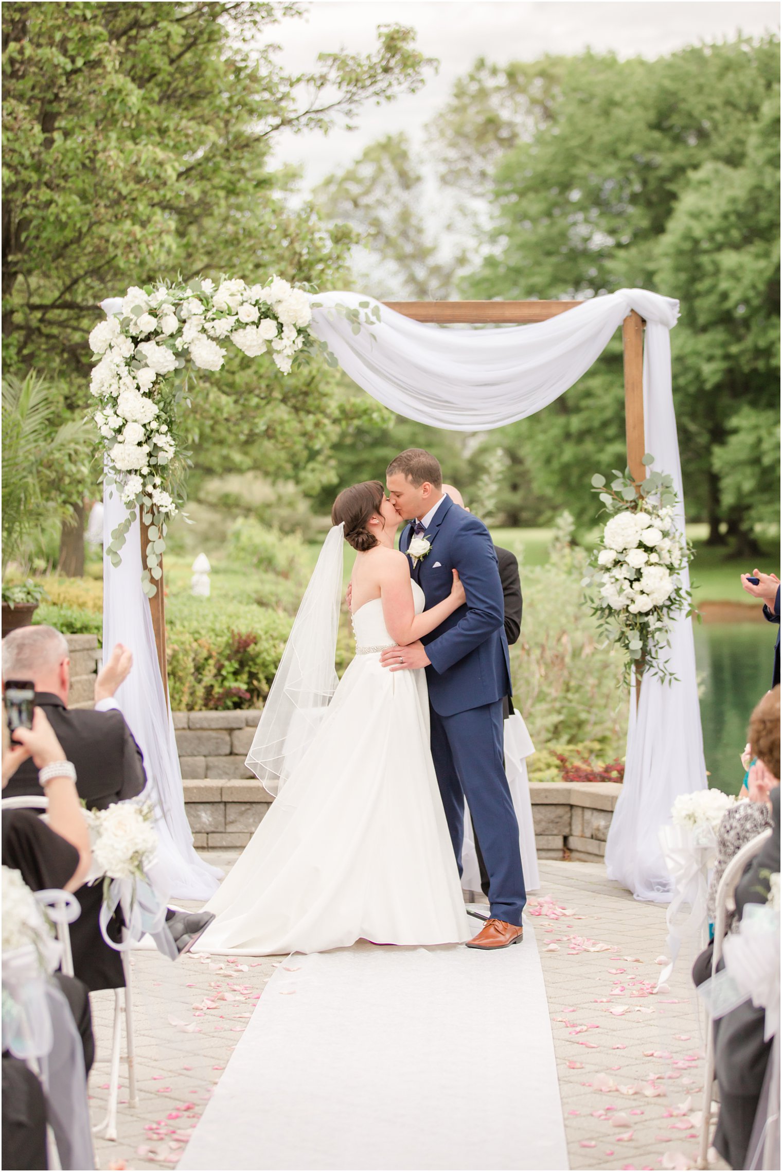 Wedding ceremony first kiss at Windows on the Water at Frogbridge in Millstone NJ
