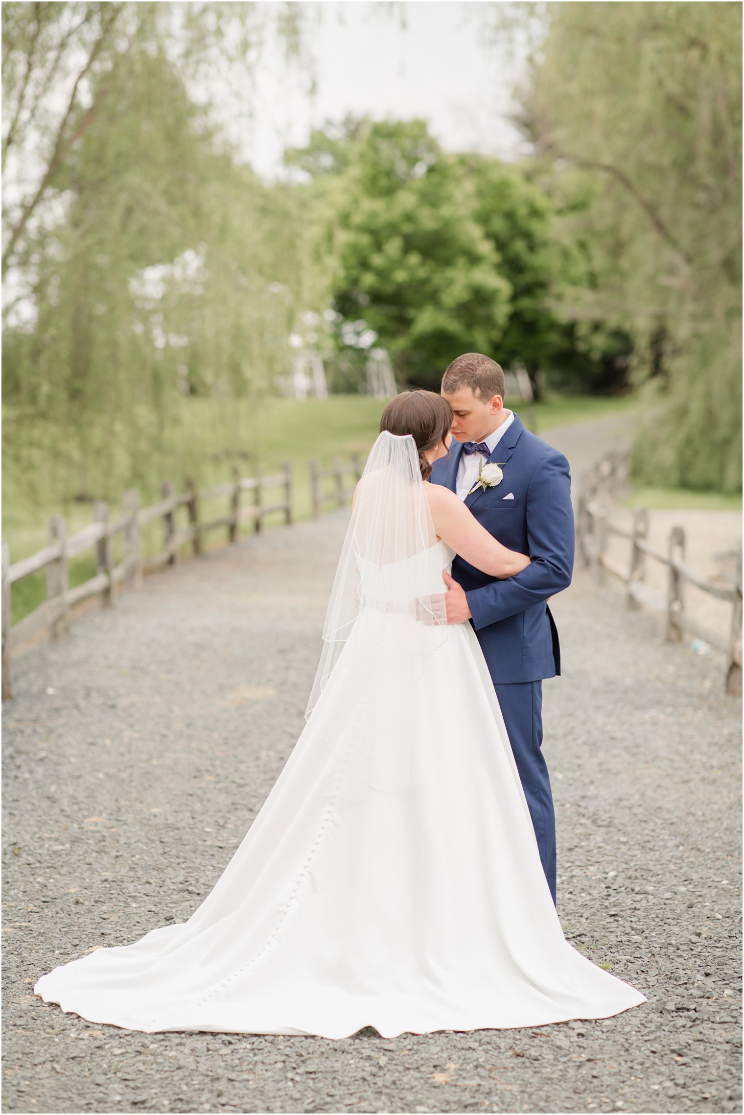 Formal bride and groom portraits at Windows on the Water at Frogbridge in Millstone NJ