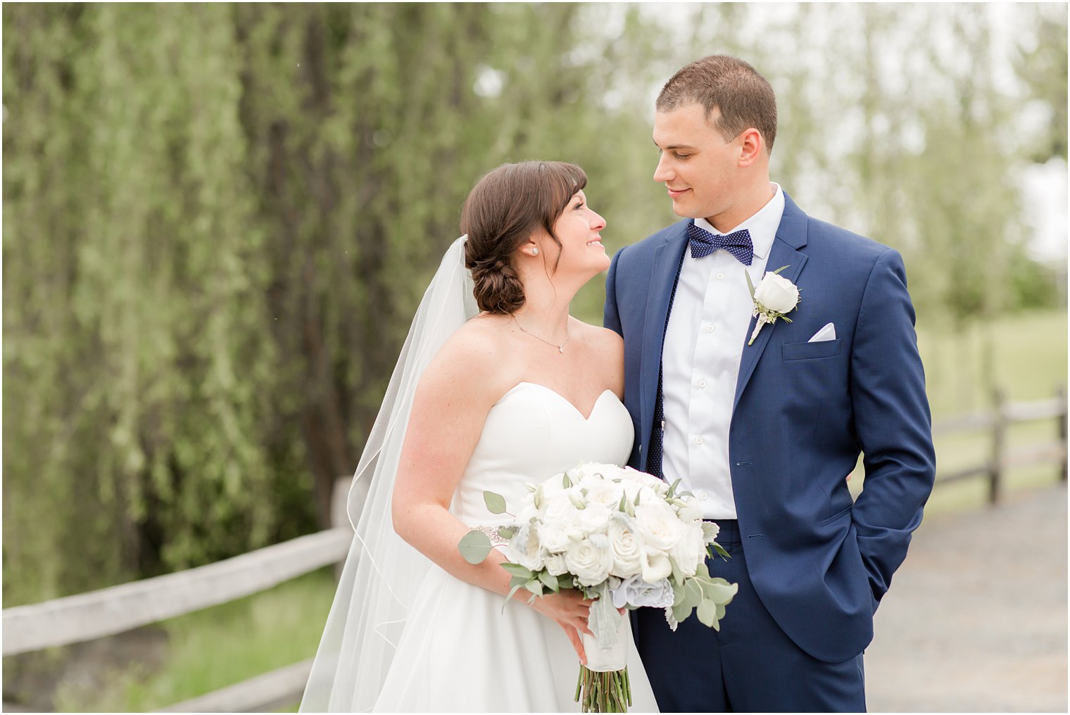 Formal bride and groom portraits at Windows on the Water at Frogbridge in Millstone NJ