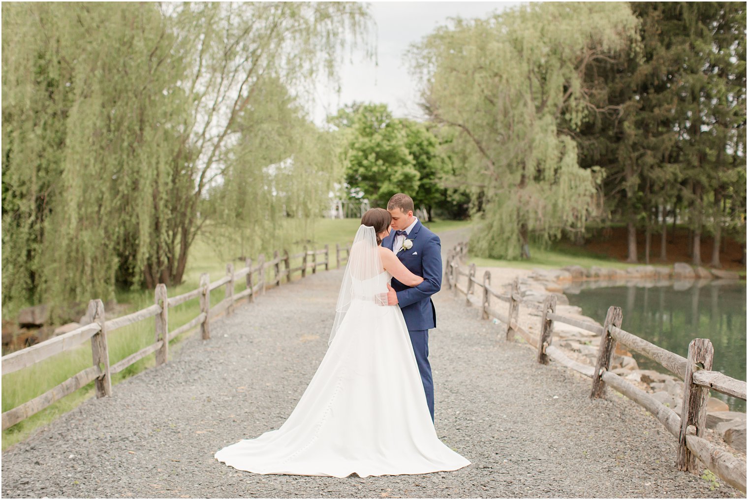 Formal bride and groom portraits at Windows on the Water at Frogbridge in Millstone NJ