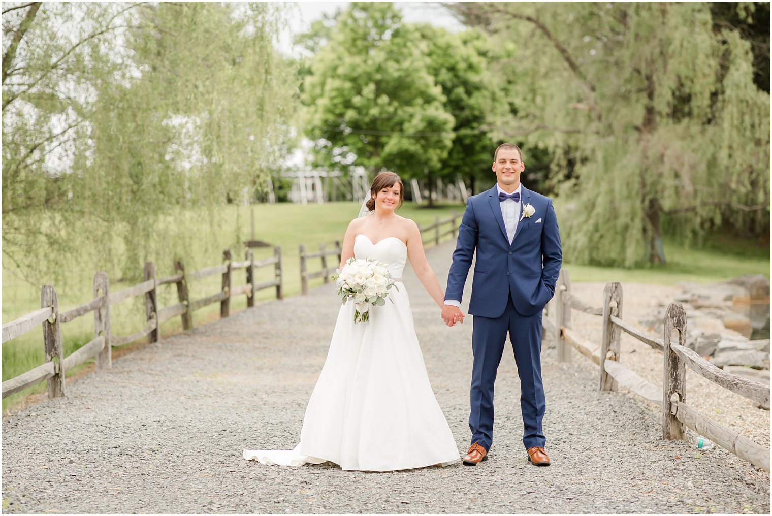 Formal bride and groom portraits at Windows on the Water at Frogbridge in Millstone NJ