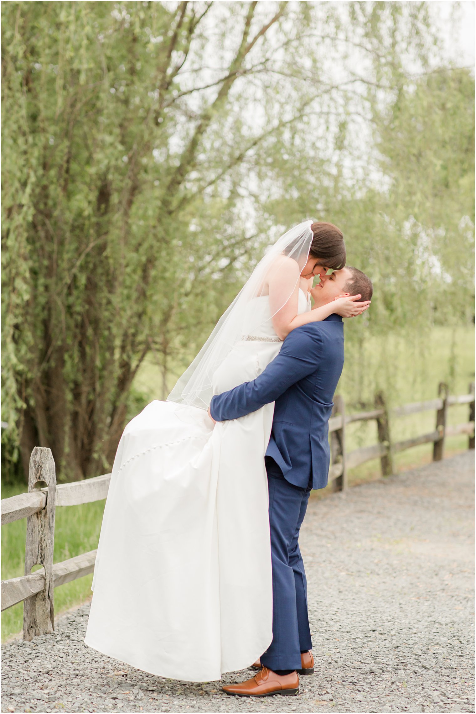 Formal bride and groom portraits at Windows on the Water at Frogbridge in Millstone NJ