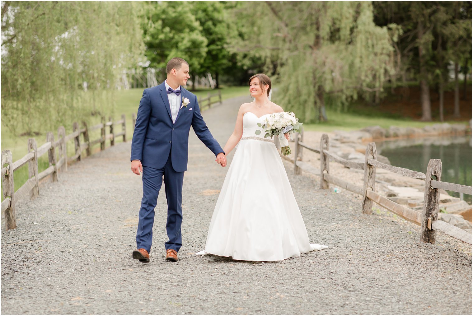 Formal bride and groom portraits at Windows on the Water at Frogbridge in Millstone NJ