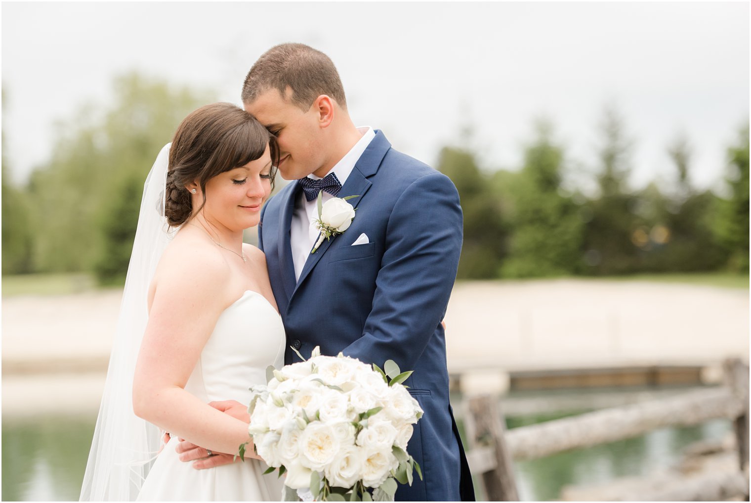 Formal bride and groom portraits at Windows on the Water at Frogbridge in Millstone NJ