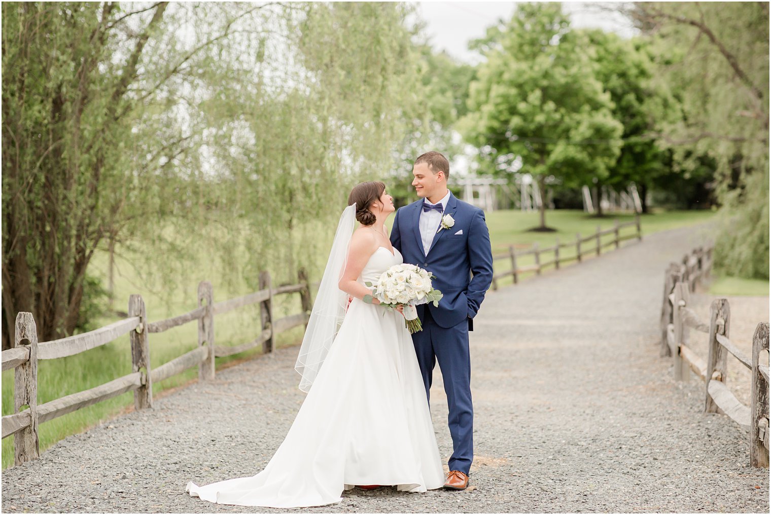 Formal bride and groom portraits at Windows on the Water at Frogbridge in Millstone NJ