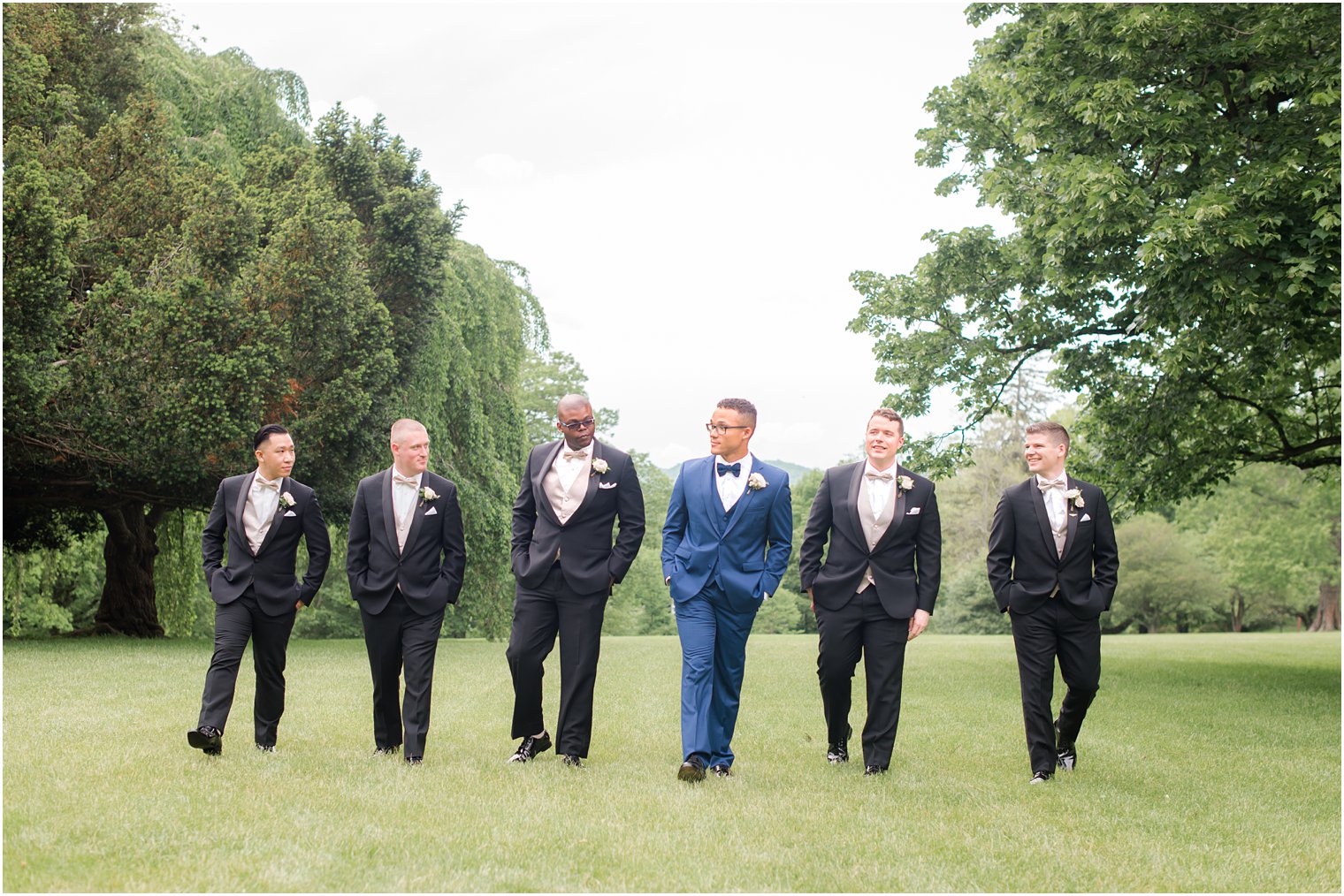 candid photo of groom and groomsmen | The Castle at Skylands Manor Wedding Photos by Idalia Photography
