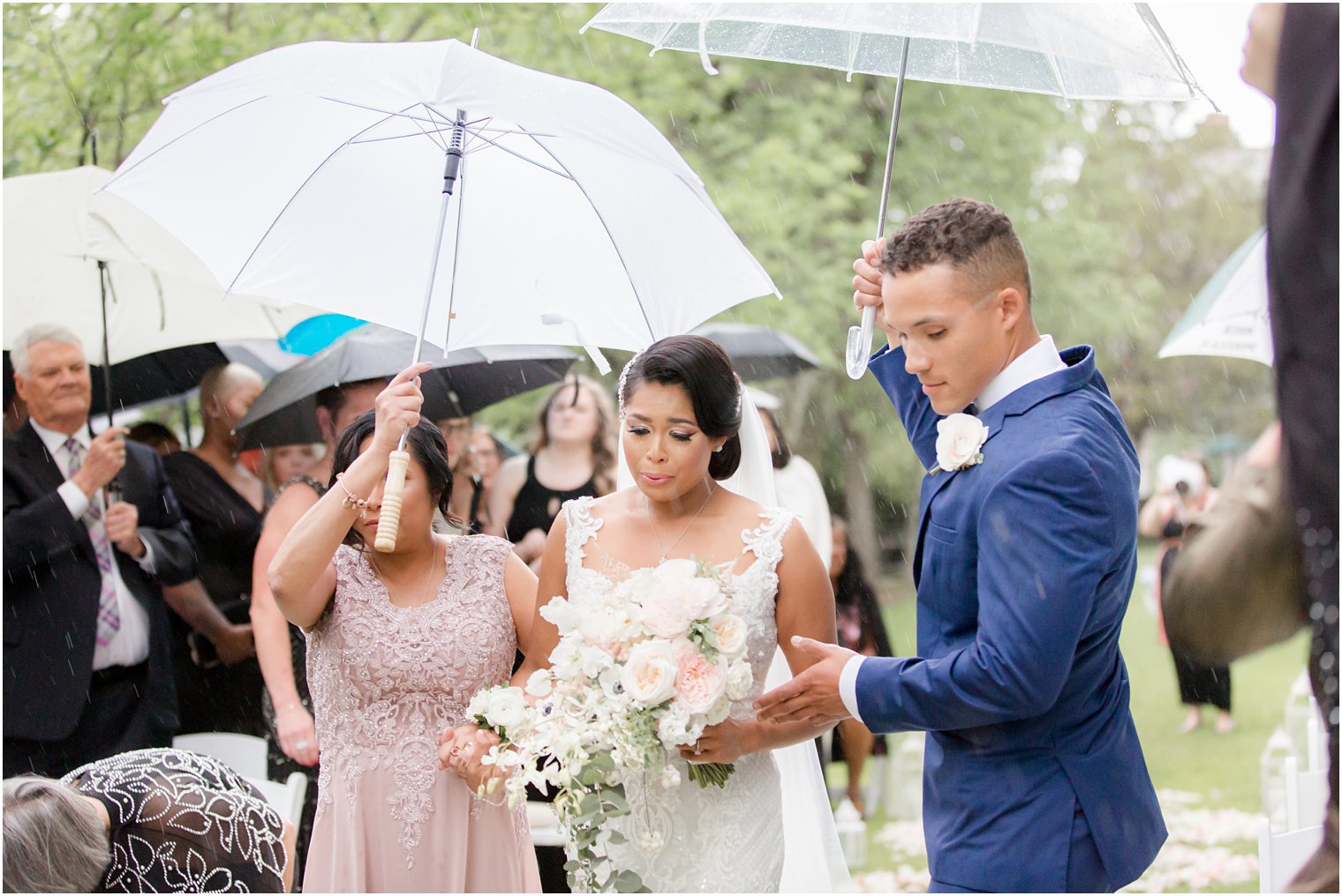bride and groom at rainy day wedding at The Castle at Skylands Manor