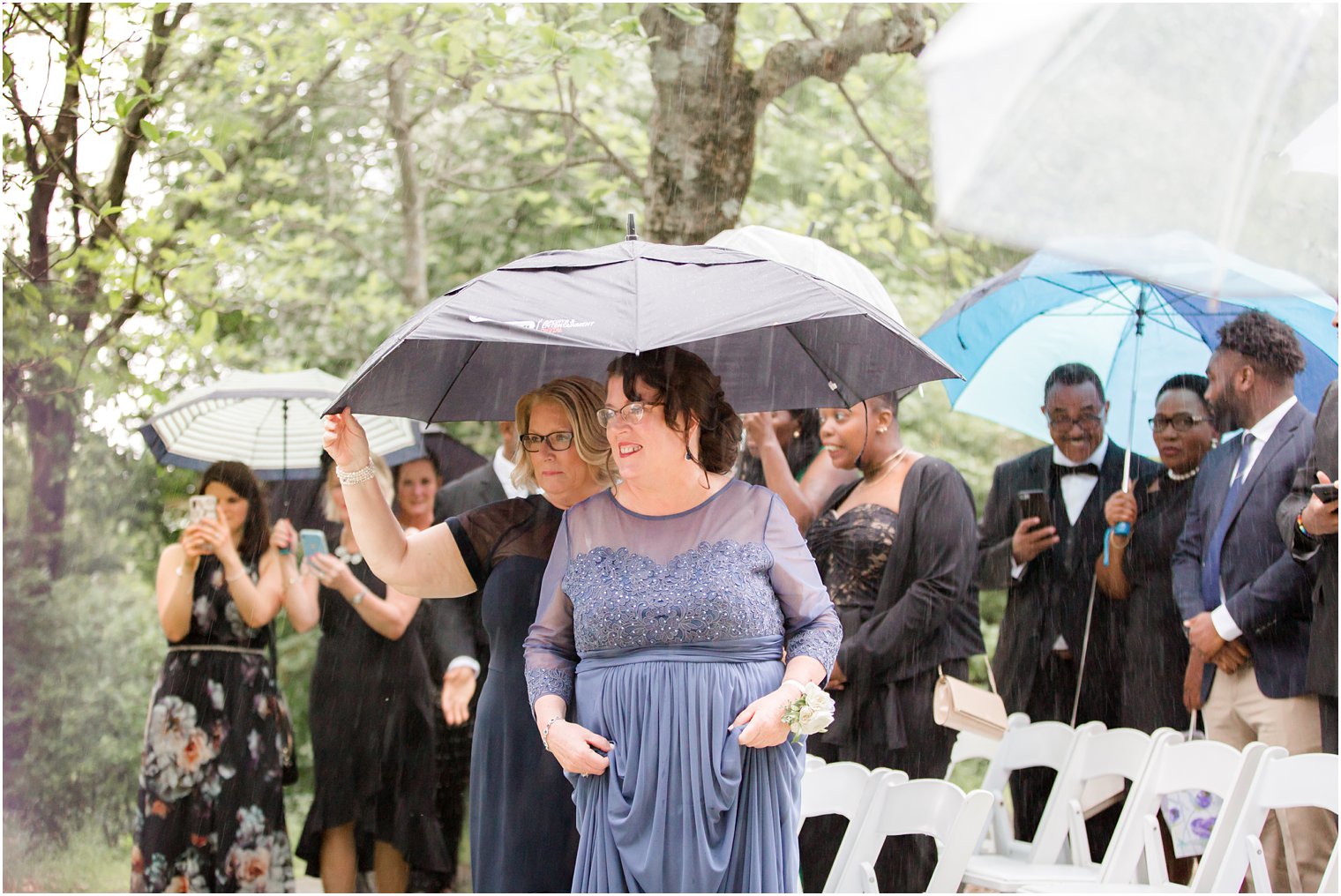 guests at rainy day wedding at The Castle at Skylands Manor