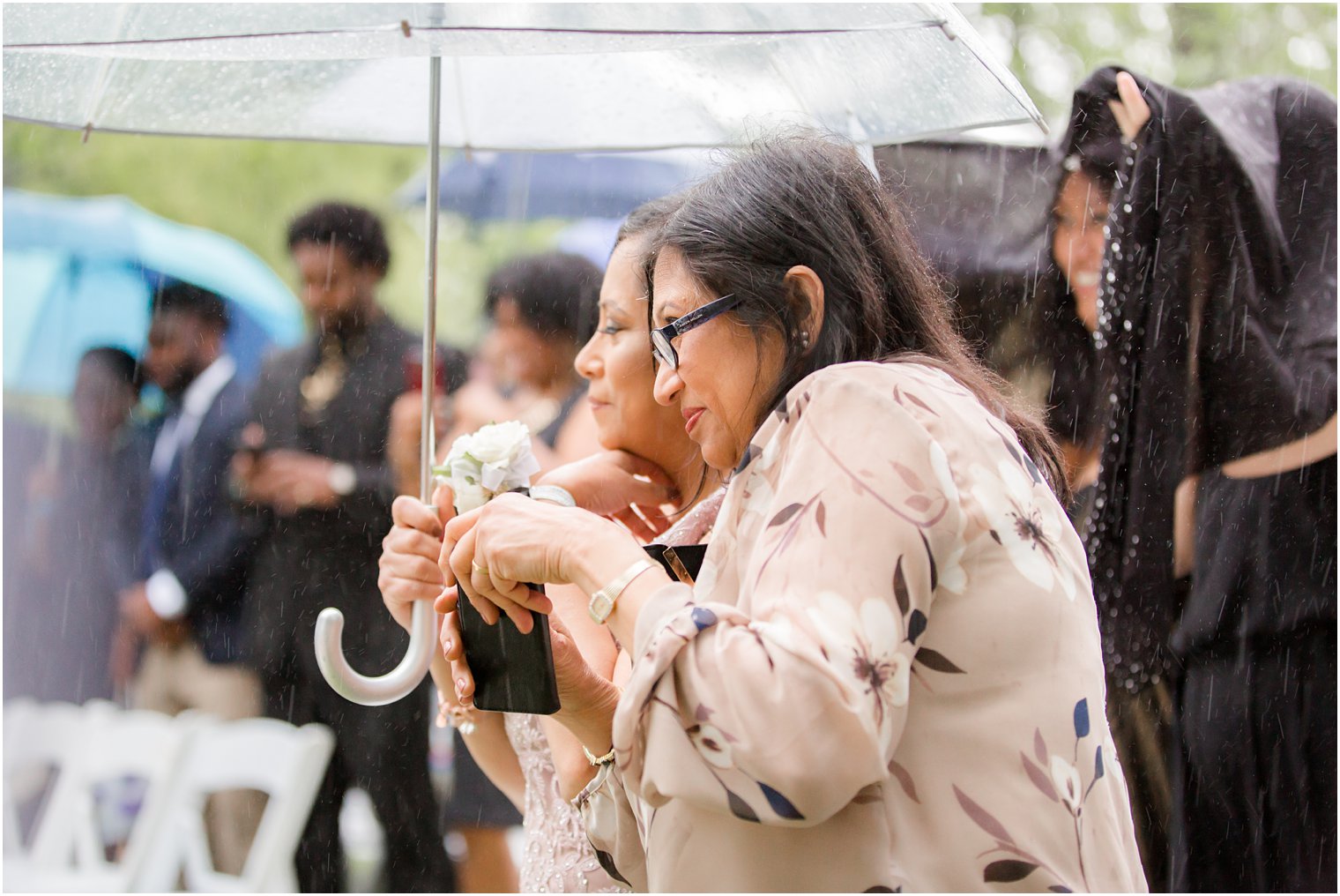 guests at rainy day wedding at The Castle at Skylands Manor