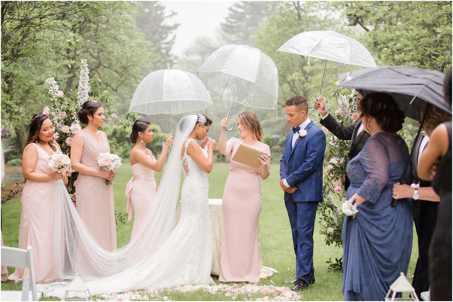 ceremony at rainy day wedding at The Castle at Skylands Manor