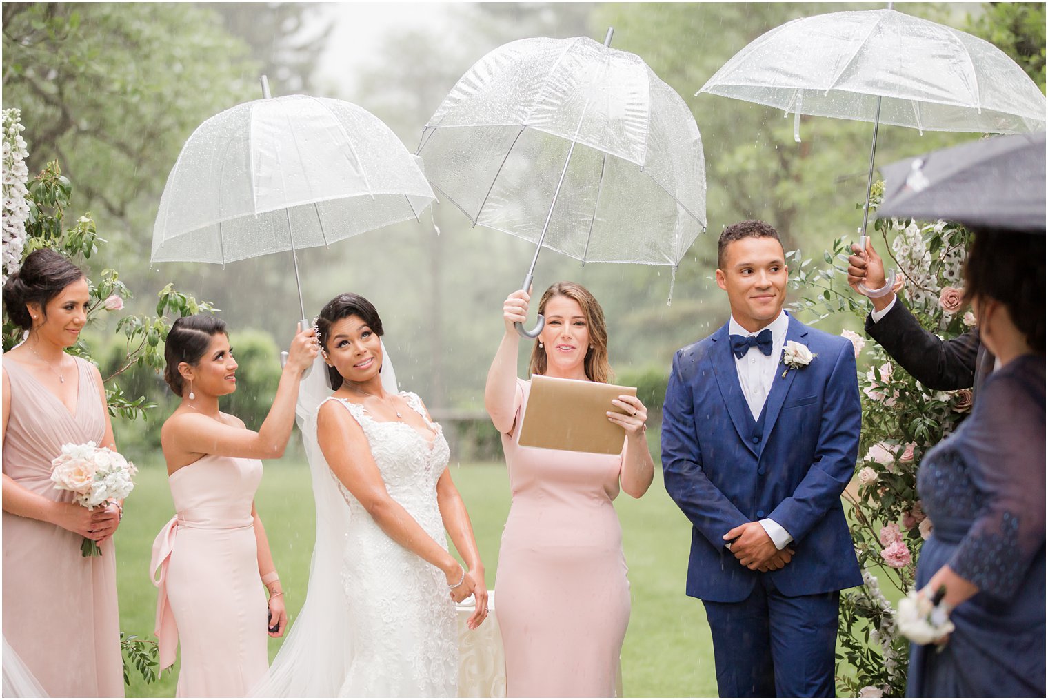 wedding ceremony at rainy day wedding at The Castle at Skylands Manor