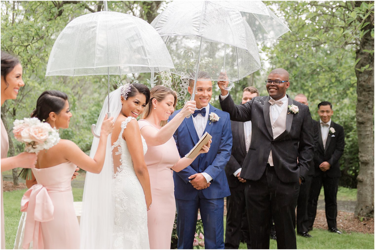 wedding ceremony at rainy day wedding at The Castle at Skylands Manor