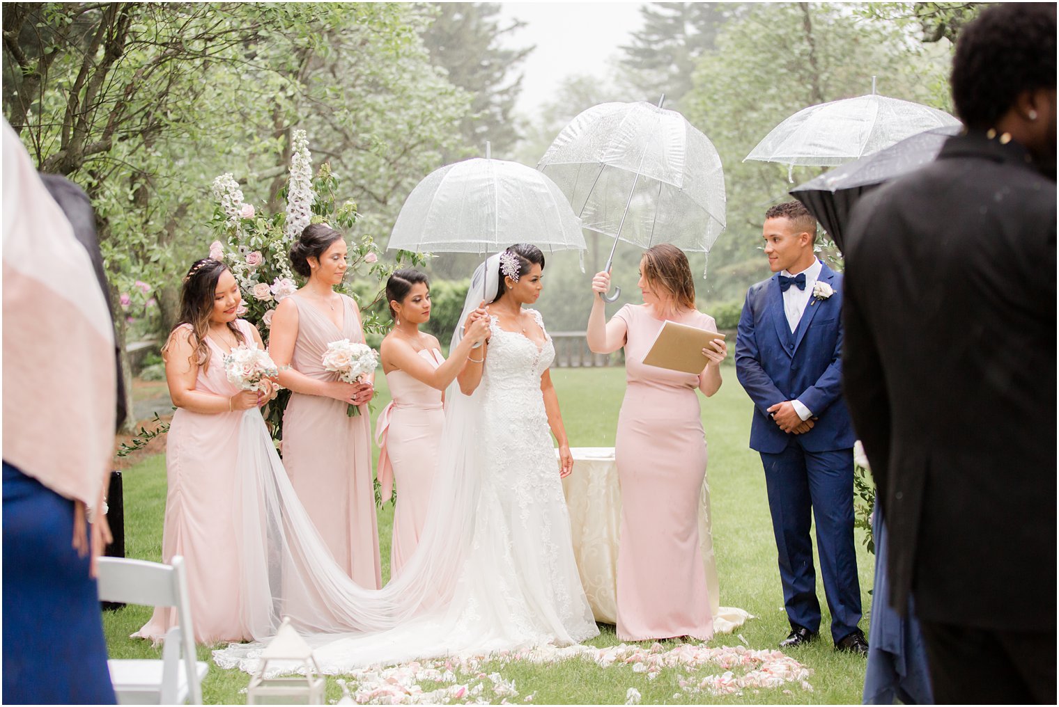 ceremony at rainy day wedding at The Castle at Skylands Manor