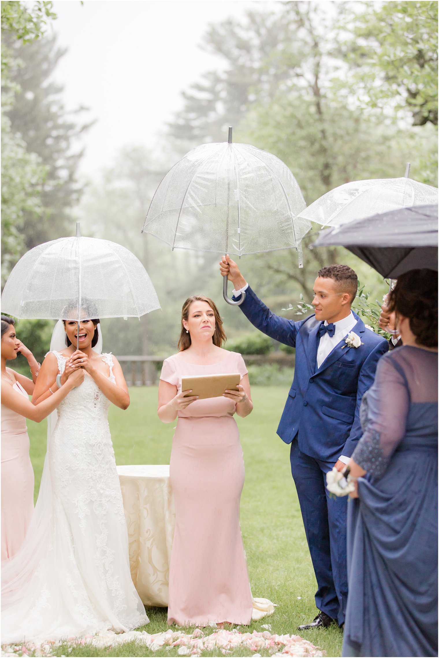 wedding ceremony at rainy day wedding at The Castle at Skylands Manor