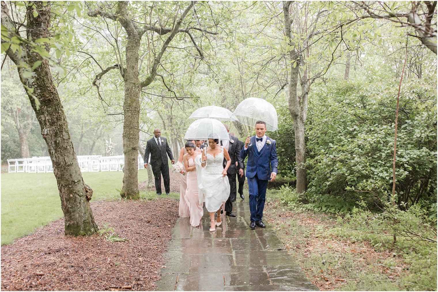 guests at rainy day wedding at The Castle at Skylands Manor