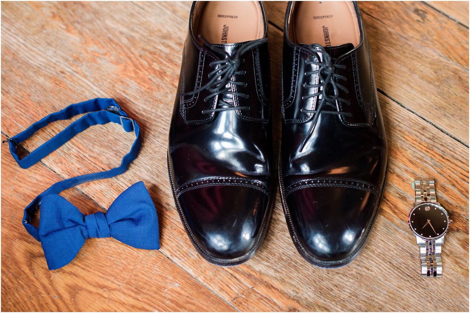 groom's shoes, bow tie, and watch
