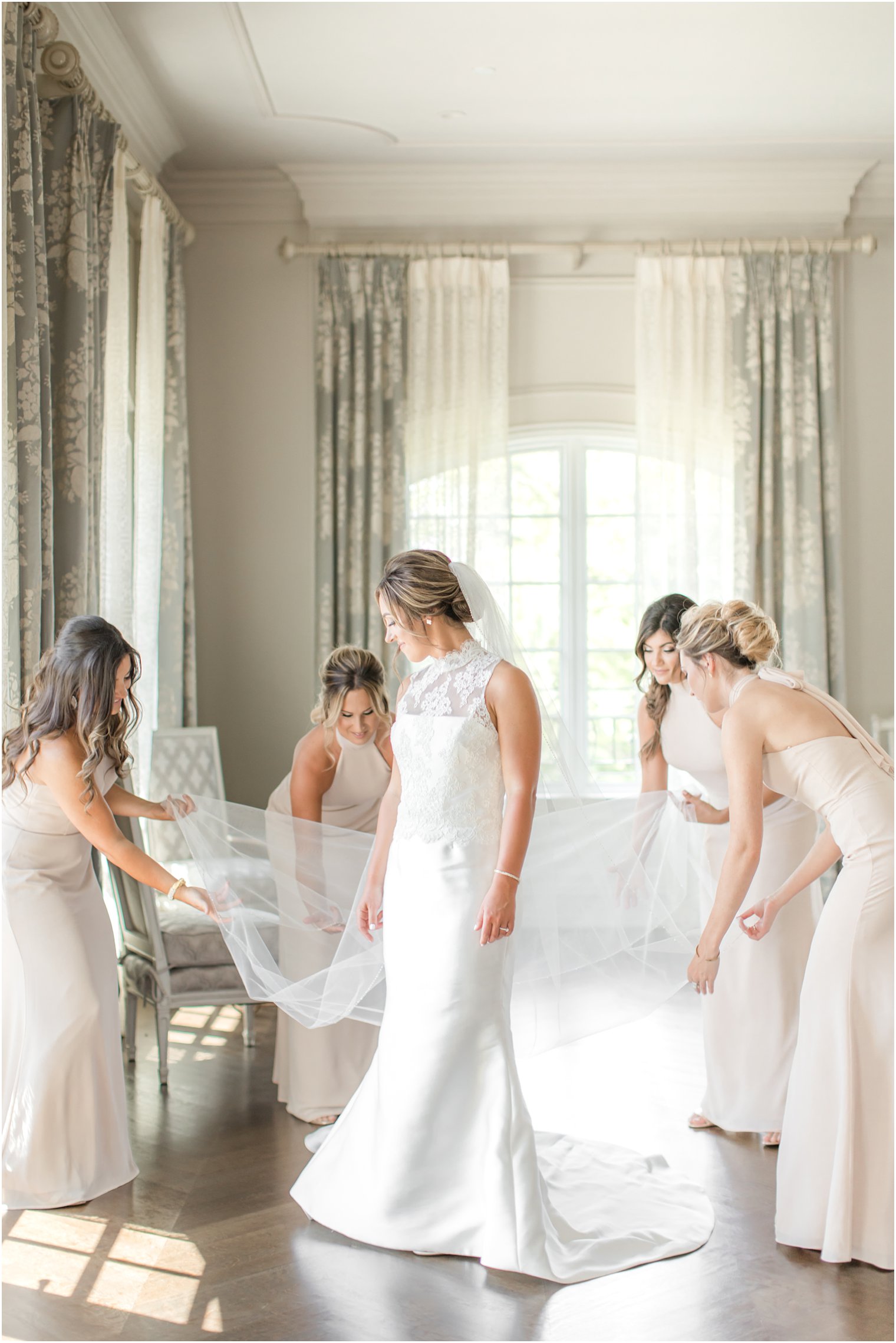 Bride getting ready with bridesmaids at Park Chateau Estate and Gardens