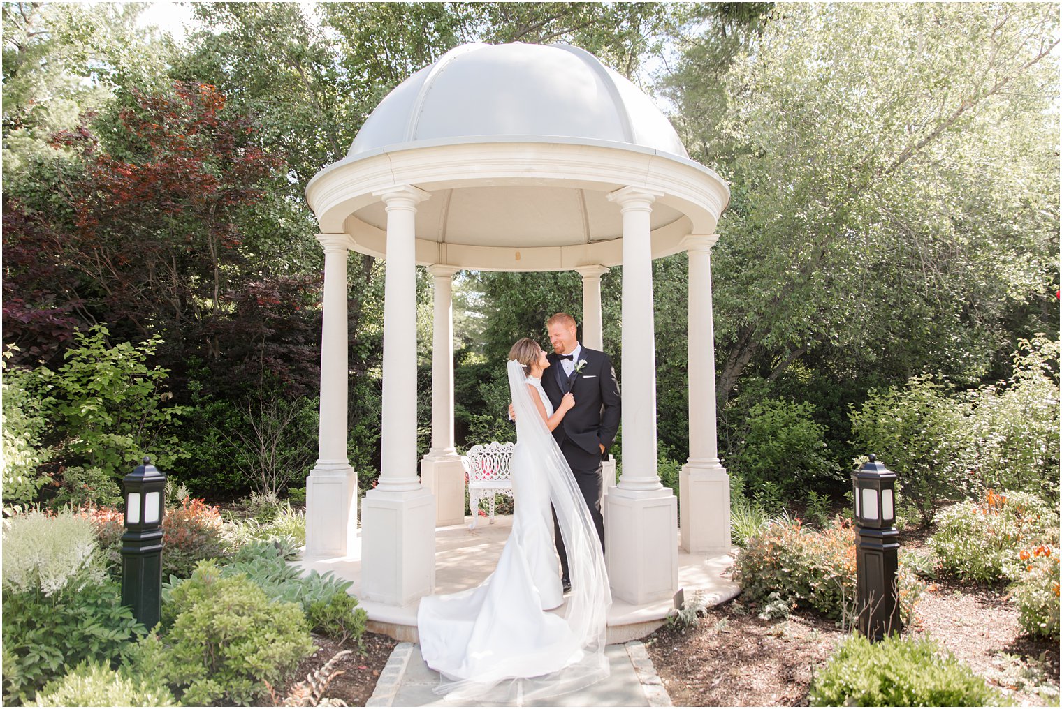 Bride and groom portrait in gazebo