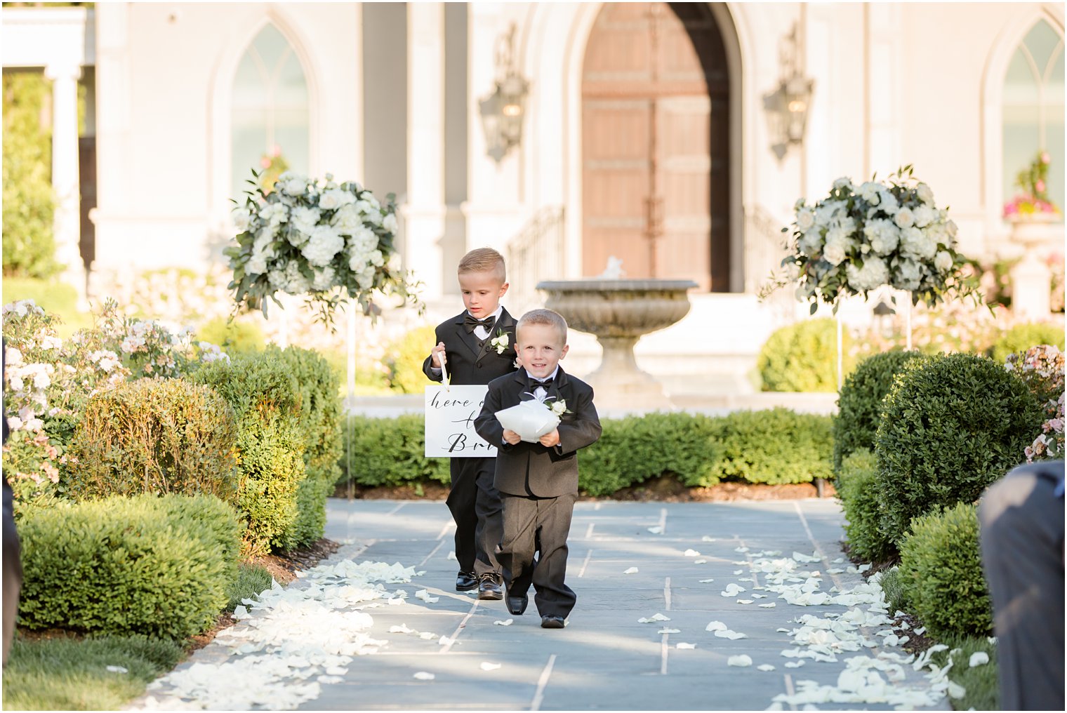 Ring bearers at outdoor wedding ceremony at Park Chateau Estate and Gardens