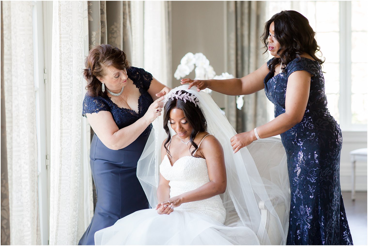 Bride getting ready with mother and mother of the groom at Park Chateau Estate Wedding