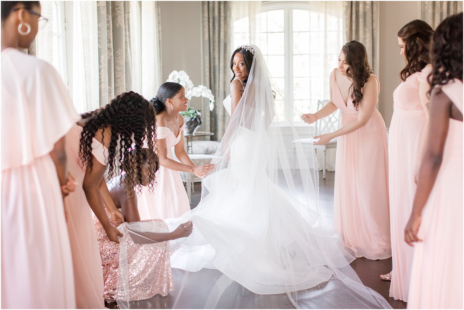 Bride showing off cathedral veil at Park Chateau Estate Wedding