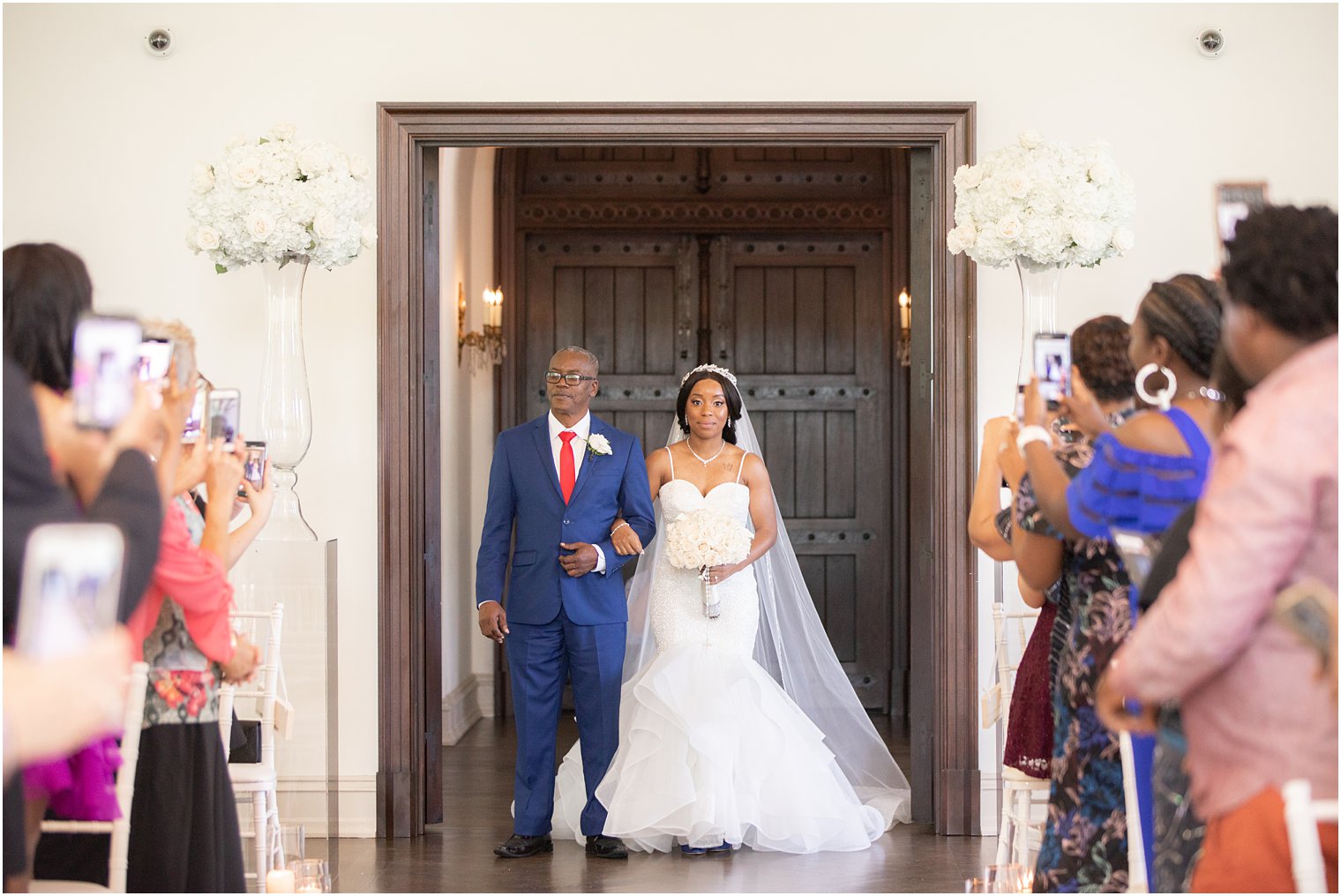 Bride walking down the aisle at Park Chateau Estate Chapel Wedding