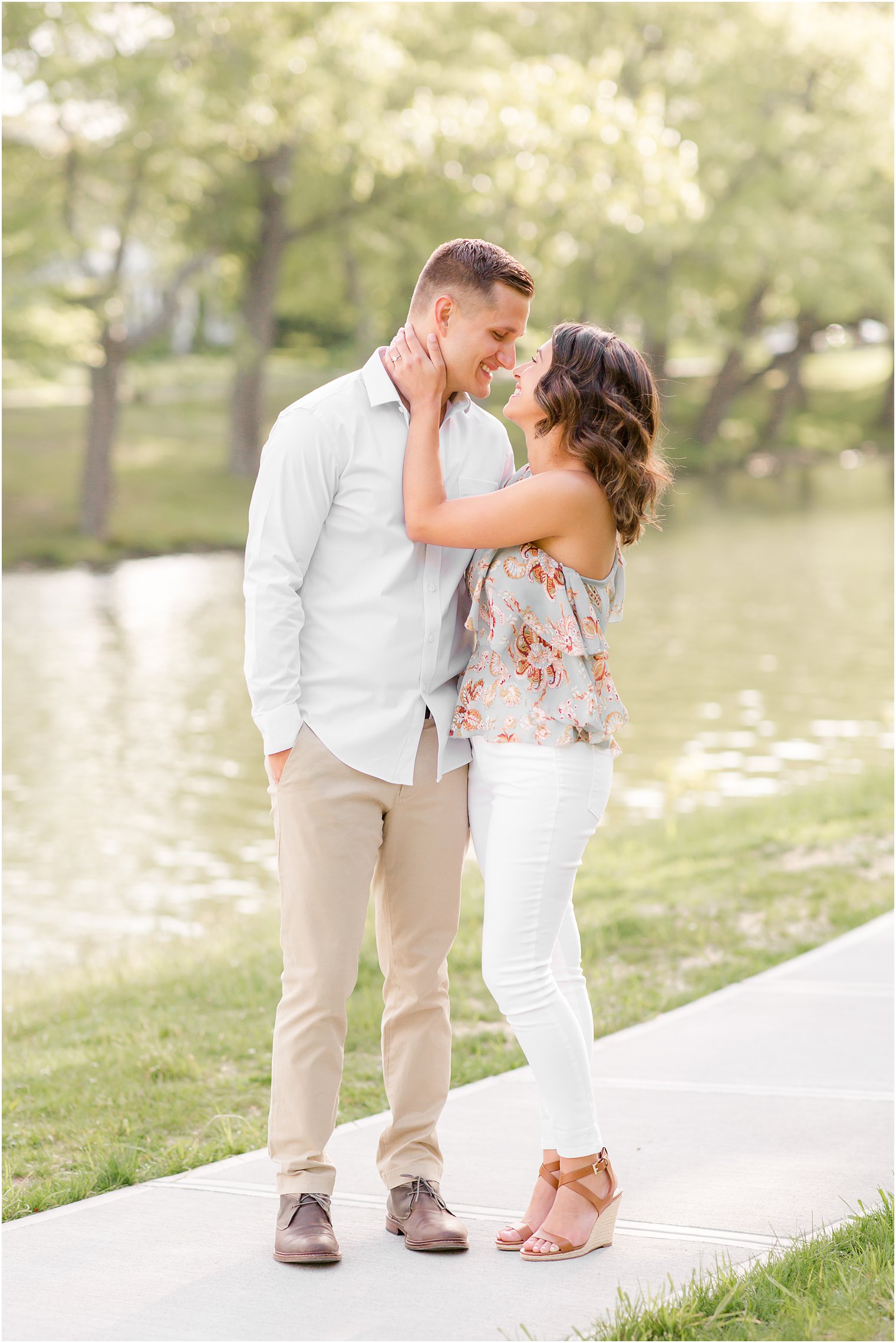 Engaged couple having fun in Spring Lake NJ by Spring Lake Wedding Photographer