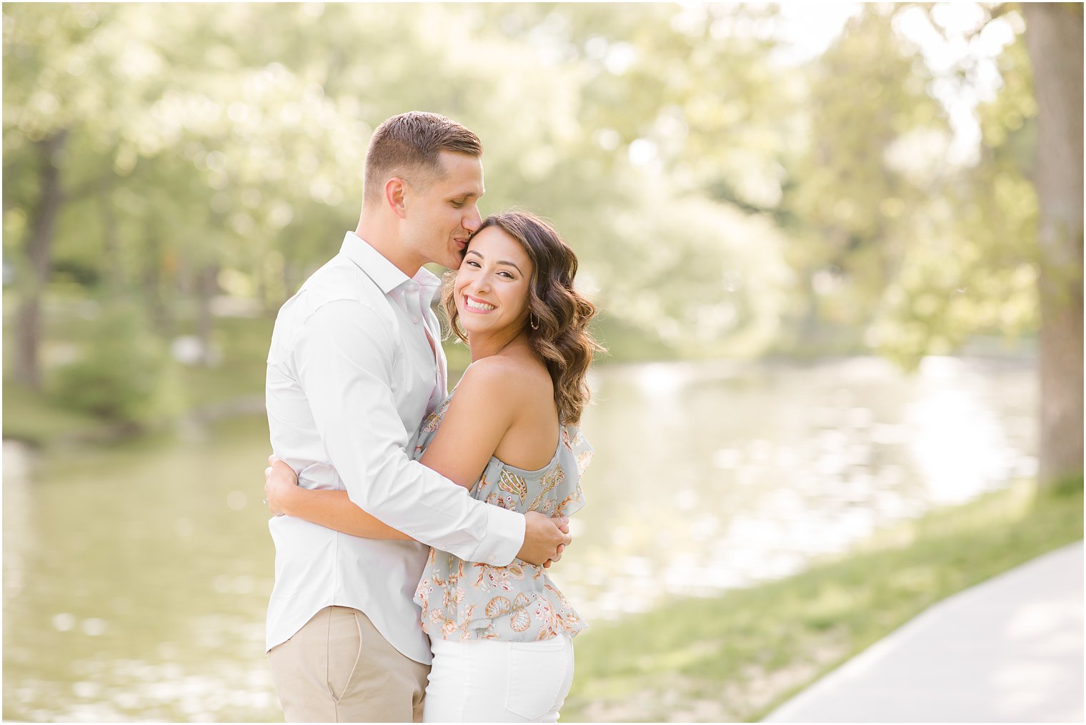 Engaged couple smiling in Spring Lake NJ by Spring Lake Wedding Photographer