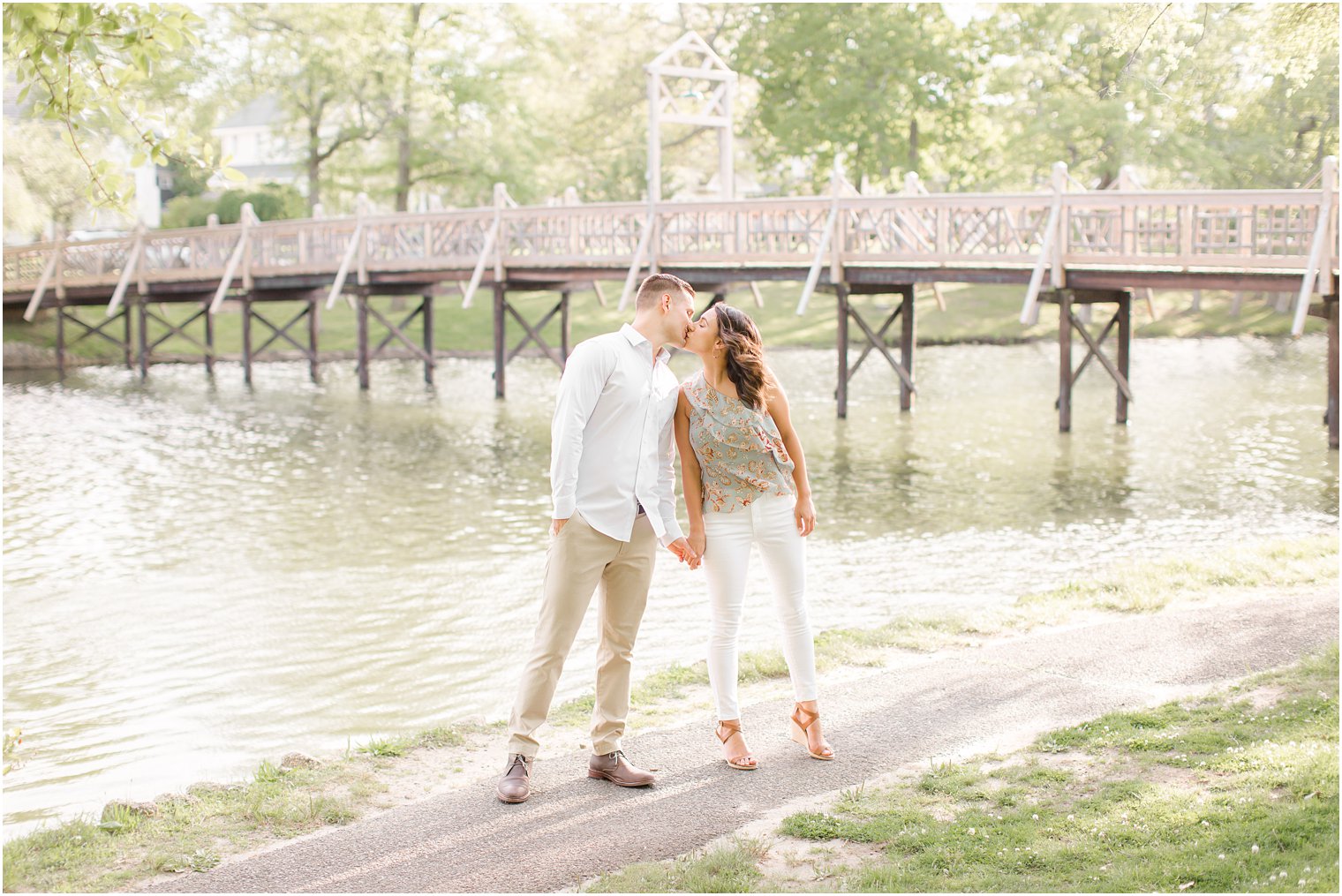 Engaged couple on a bridge in Spring Lake NJ by Spring Lake Wedding Photographer