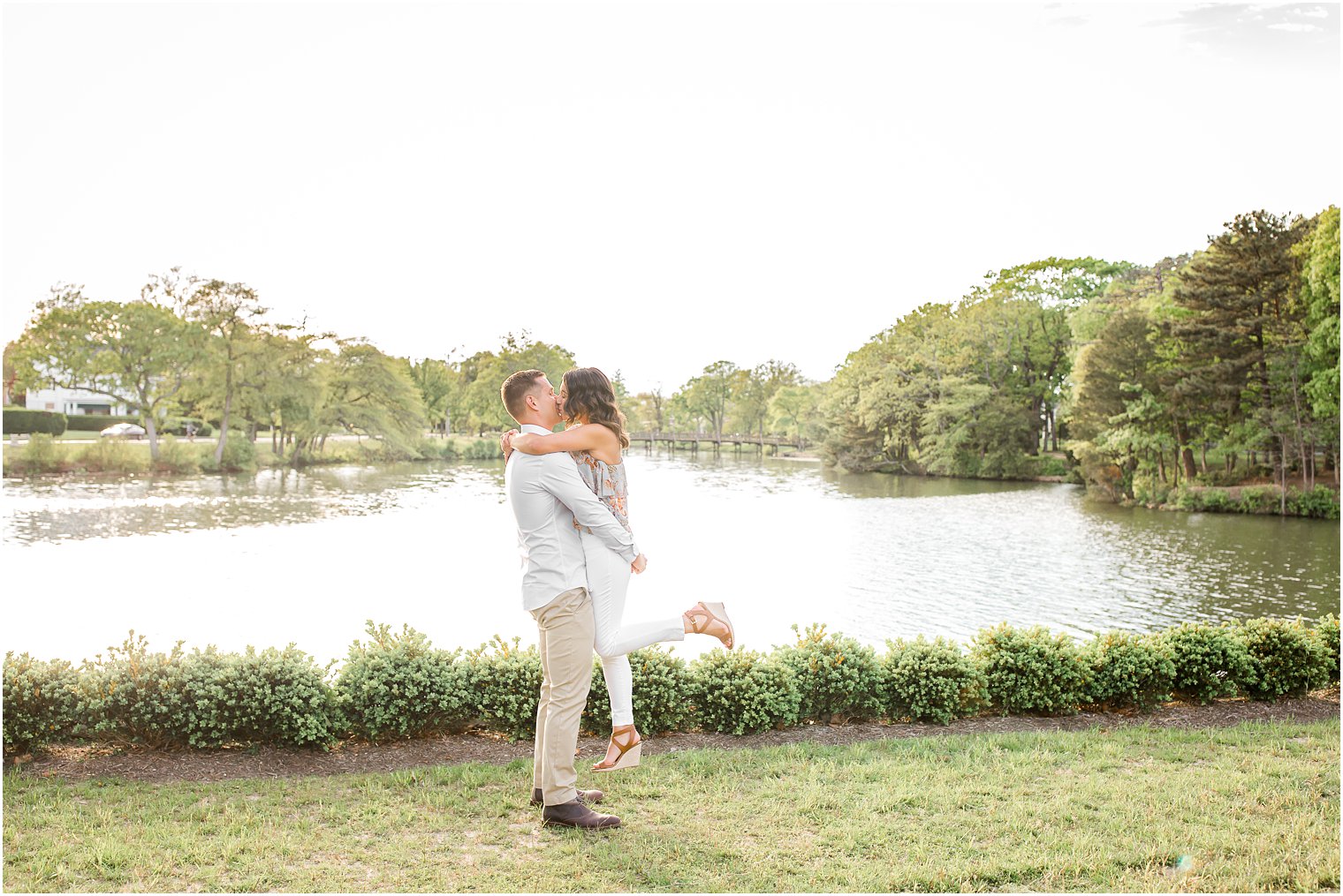 Engaged couple on a bridge in Spring Lake NJ by Spring Lake Wedding Photographer