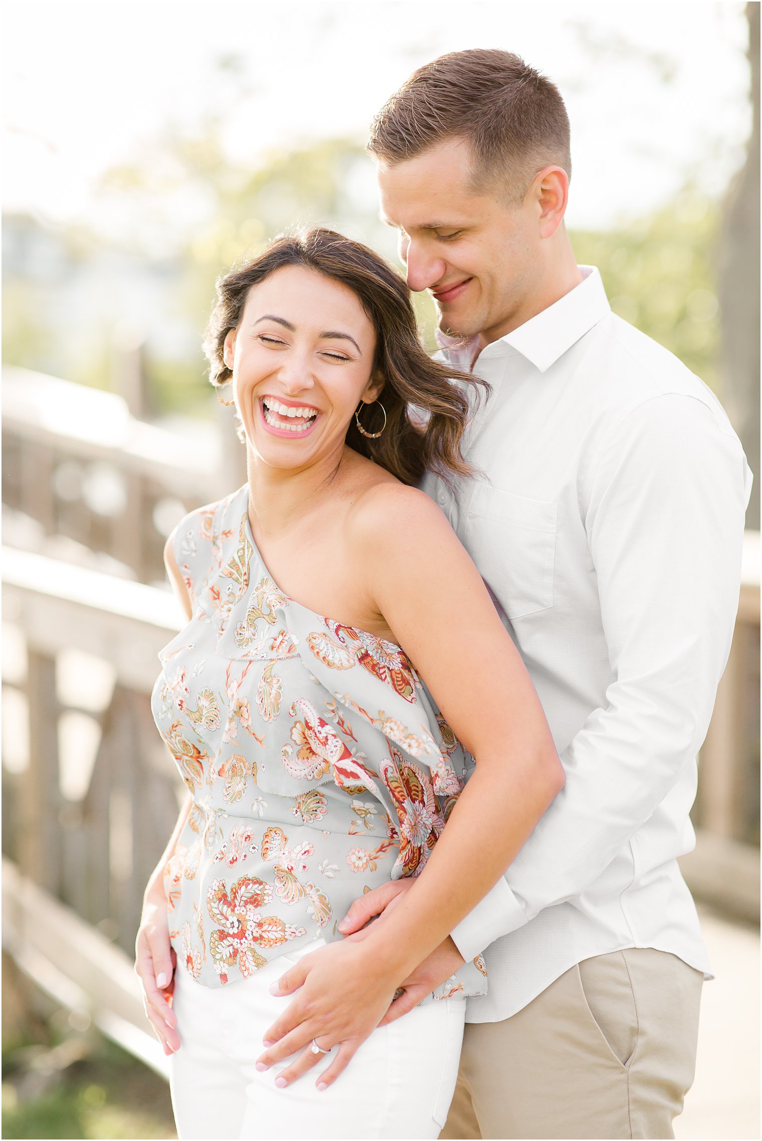 Engaged couple laughing in Spring Lake NJ by Spring Lake Wedding Photographer